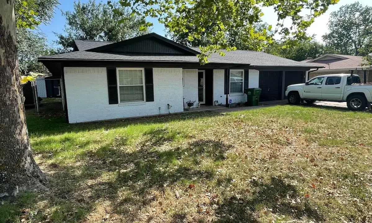 Professional roofing crew working on a residential roof in Somerset